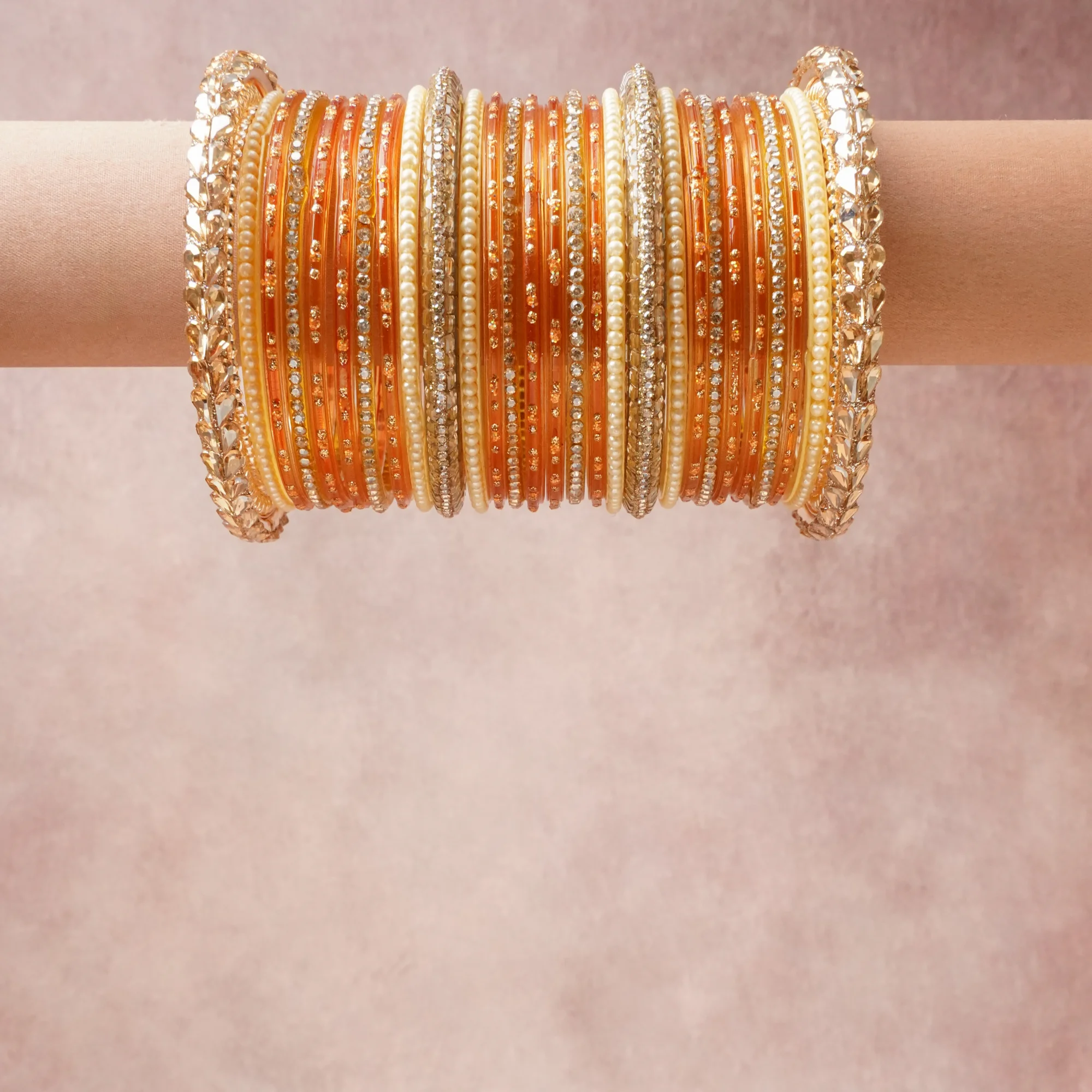 A grounding Orange forms the heart of the set, while touches of Rich Gold, Ivory, Clear Crystal add charm.

A thoughtful composition of Glass, Imitation Pearl, Rhinestone, Gold-toned Metal, designed to feel complete without being heavy.
Each element layers seamlessly, creating a look that is refined, wearable and quietly striking.